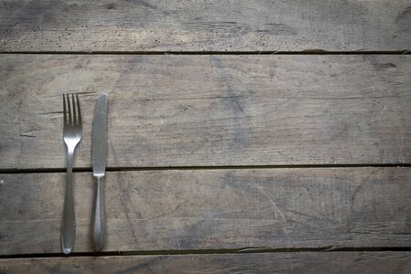 Fork and Knife on wooden background.の写真素材