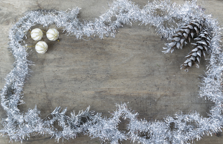 Frame from christmas decoration with copy space on wooden background.の写真素材
