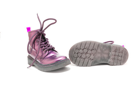 Purple children shoes for winter isolated on white background.の写真素材