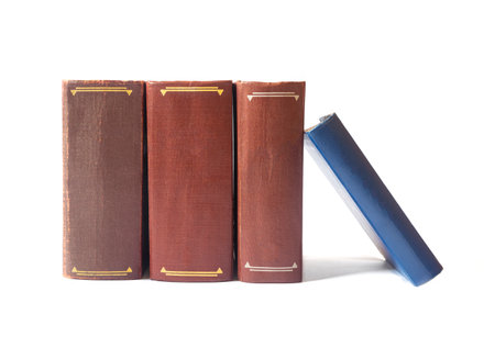 Old books with yellow pages isolated on white backgroundの写真素材