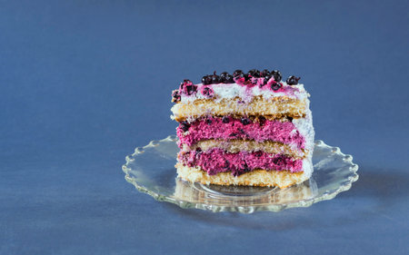 Piece of blueberry cake on blue background. selective focus.の写真素材