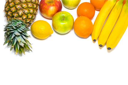 Healthy fruits (apples, pineapple, bananas, oranges, lemon) isolated on white background.の写真素材