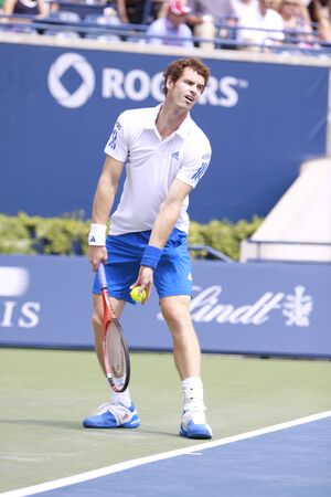 TORONTO: AUGUST 15. Andy Murray plays against Roger Federer in the Rogers Cup 2010 finals on August 15, 2010 in Toronto, Canada.のeditorial素材