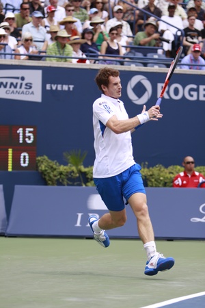 TORONTO: AUGUST 15. Andy Murray plays against Roger Federer in the Rogers Cup 2010 finals on August 15, 2010 in Toronto, Canada.のeditorial素材