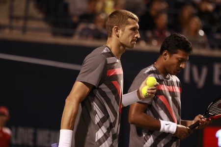TORONTO: AUGUST 12. Max Mirnyi and Mahesh Bhupathi play against Robert Lindstedt and Horia Tecau in the Rogers Cup 2010 on August 12, 2010 in Toronto, Canada.のeditorial素材