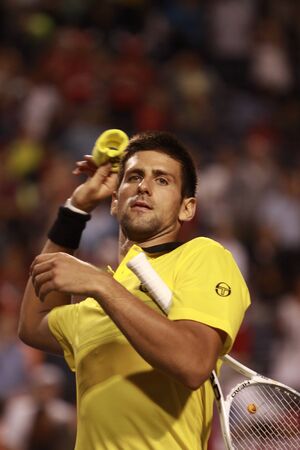 TORONTO: AUGUST 13. Novak Djokovic greets fans after he won a tournament with Jeremy Chardy  in the Rogers Cup 2010 on August 13, 2010 in Toronto, Canada.のeditorial素材