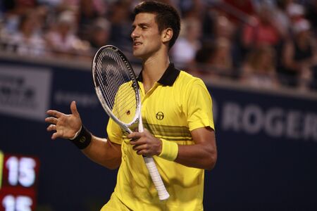 TORONTO: AUGUST 14. Novak Djokovic plays against Roger Federer   in the Rogers Cup 2010 on August 14, 2010 in Toronto, Canada.のeditorial素材