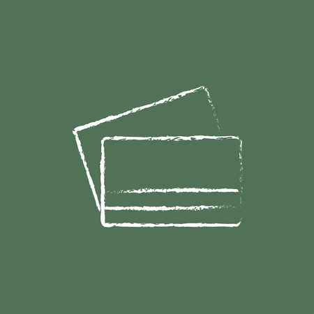 Credit card hand drawn in chalk on a blackboard vector white icon isolated on a green background.のイラスト素材