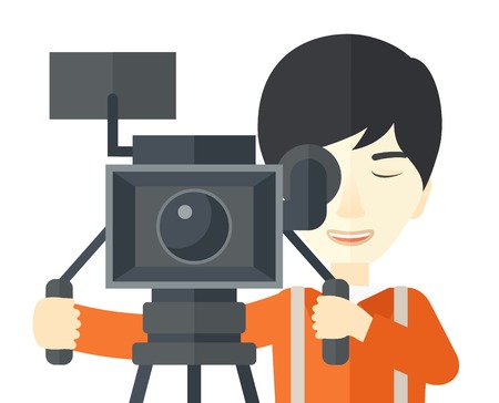 An asian cameraman looking through movie camera on a tripod vector flat design illustration isolated on white background. Horizontal layout.のイラスト素材