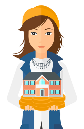 A woman holding model of house in hands vector flat design illustration isolated on white background.のイラスト素材