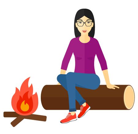 An asian woman sitting on a log at camp near the fire vector flat design illustration isolated on white background.のイラスト素材