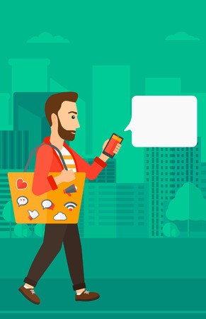 A hipster man with the beard walking with a smartphone and a bag full of social media icons on a city background vector flat design illustration. Vertical layout.のイラスト素材