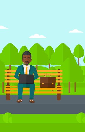 An african-american man sitting in the park on a bench and working on a laptop vector flat design illustration. Vertical layout.のイラスト素材