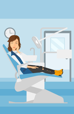 A woman sitting in chair in dental office and suffering from tooth pain vector flat design illustration. Vertical layout.のイラスト素材