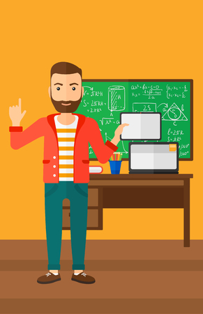 A hipster man with the beard standing with a tablet computer and pointing his forefinger up on the background of classroom vector flat design illustration. Vertical layout.のイラスト素材