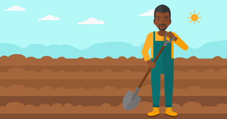 An african-american man with shovel on a background of plowed agricultural field vector flat design illustration. Horizontal layout.のイラスト素材