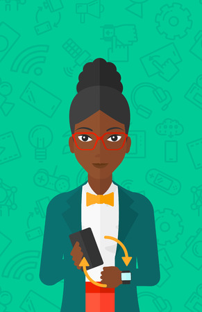An african-american woman holding a smartphone and looking at her smart watch on a green background with technology icons vector flat design illustration. Vertical layout.のイラスト素材
