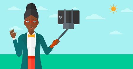 An african-american woman making selfie with a selfie-stick on the background of blue sky vector flat design illustration. Horizontal layout.のイラスト素材