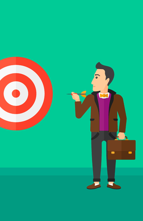 A businessman standing with arrow in hand and aiming at a target board on a green background vector flat design illustration. Vertical layout.のイラスト素材