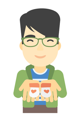 An asian man holding baby booties in hands vector flat design illustration isolated on white background.のイラスト素材