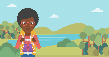 An african-american woman with backpack walking in the mountains. Female backpacker with binoculars. Female traveler hiking in mountains. Vector flat design illustration. Horizontal layout.のイラスト素材