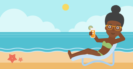 An african-american woman sitting in a chaise longue and holding a cocktail in hand on the background of sand beach with blue sea. Vector flat design illustration. Horizontal layout.のイラスト素材
