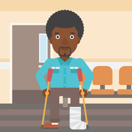 An african-american injured man with leg in plaster using crutches while standing in the hospital corridor. Vector flat design illustration. Square layout.のイラスト素材