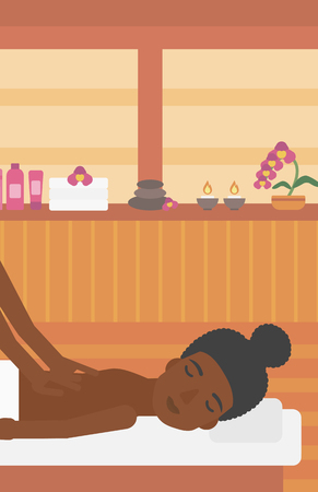 An african-american woman getting a back massage on the background of spa center. An african-american woman having back massage in the spa salon. Vector flat design illustration. Vertical layout.の写真素材