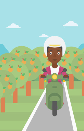 An african-american young woman riding a scooter on the asphalt road through the orchard. Young woman in helmet driving a scooter. Vector flat design illustration. Vertical layout.のイラスト素材