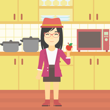 An asian young woman holding an apple in the kitchen. Young woman eating an apple in the kitchen. Woman with an apple at home. Vector flat design illustration. Square layout.のイラスト素材
