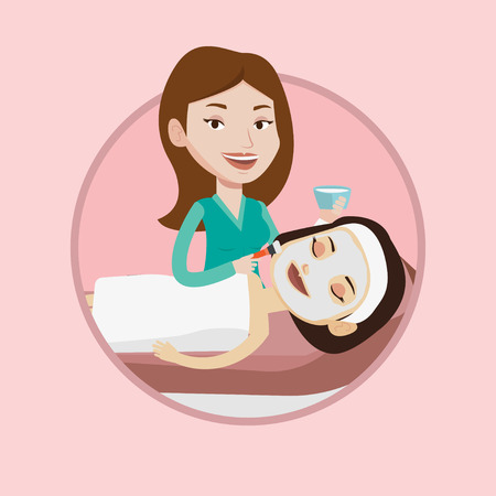 Cosmetologist applying cosmetic mask on face of client in beauty salon. Woman lying on table in salon during cosmetology procedure. Vector flat design illustration in the circle isolated on backgroundのイラスト素材