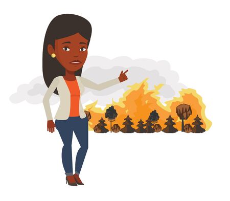 African woman pointing at forest in fire. Frustrated woman standing on the background of forest fire. Concept of environmental destruction. Vector flat design illustration isolated on white backgroundのイラスト素材