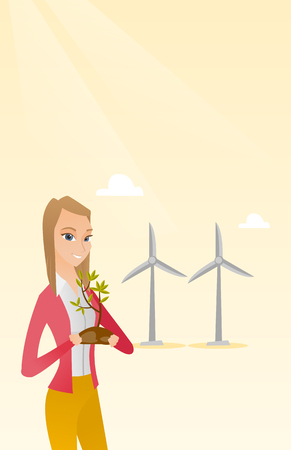 Young caucasian female worker of wind farm. Woman holding in hands green small plant in soil on the background of wind turbines. Green energy concept. Vector flat design illustration. Vertical layout.のイラスト素材