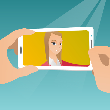 Young joyful caucasian woman making selfie. Smiling woman making selfie with a cellphone. Woman taking photo. Woman taking selfie using her smartphone. Vector flat design illustration. Square layout.のイラスト素材