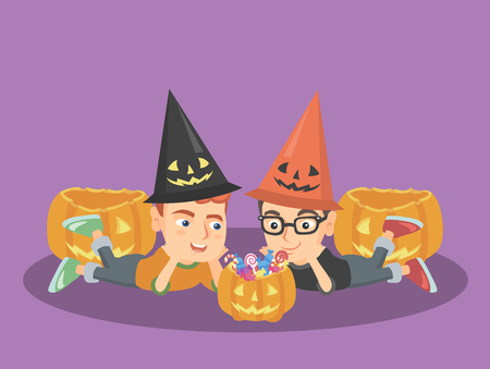 Caucasian boys in a halloween hats laying on the floor and staring at the pumpkin with a lot of candies. Boys with sweets in pumpkin basket on Halloween. Vector cartoon illustration. Square layout.のイラスト素材