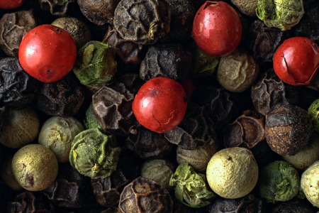 Macro photography of mixed peppercorns in dark tones top viewの写真素材