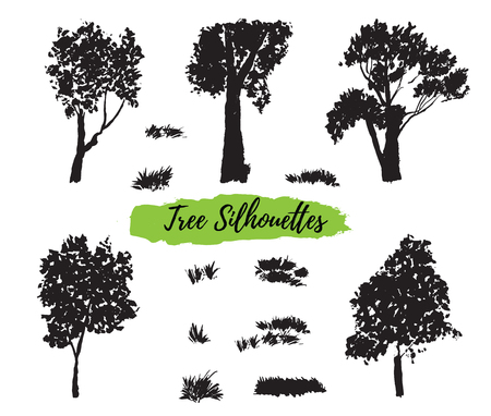 Collection of silhouettes of trees and herbs, hand-painted with watercolors on white background. The vector format.のイラスト素材