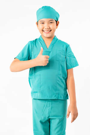 Portrait of Young Asian Boy Dressing to be Doctor Isolate on White Background with Copy space, Education Conceptの写真素材