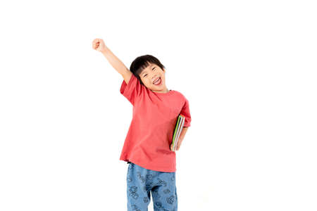 Portrait of Happy asian boy with books isolated on white background, Education and learning with technology conceptの写真素材