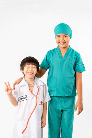 Portrait of Young Asian Boy Dressing to be Doctor Isolate on White Background with Copy space, Education Conceptの写真素材