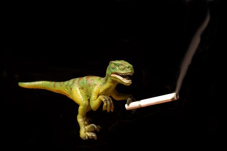 On the image there is a dinosaur. He is smoking. の写真素材
