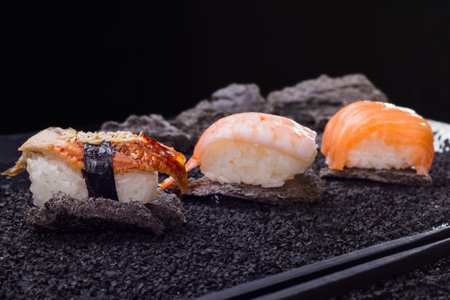 Japanese Cuisine - Sushi Roll with Shrimps, Eel, salmon, Cream Cheese and Tobiko inside.の写真素材