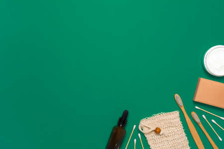 Natural zero waste cosmetics for healthy skin and face on green background. Eco friendly bath essentials. Flat lay top view, copy spaceの写真素材