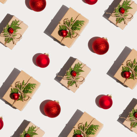 Christmas or New year pattern made of zero waste present and red balls on white background. Winter concept. Flat lay top viewの写真素材