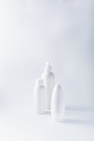 White bottles mockup for branding. Set of cosmetic products for cream, soup, deodorant, shampoo on...