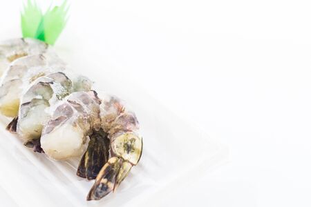 Picture of frozen prawns on white background