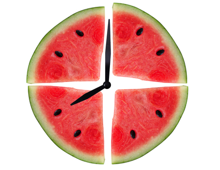 Watermelon clock on white background, summer time conceptの写真素材
