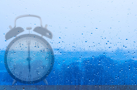 Time management concept, business planning, clock reflection on glass window