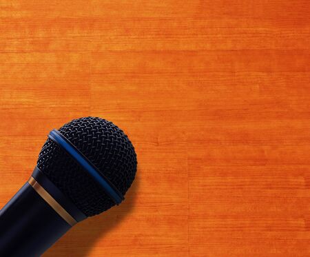 Journalist interview concept, speak microphone on wood backgroundの写真素材