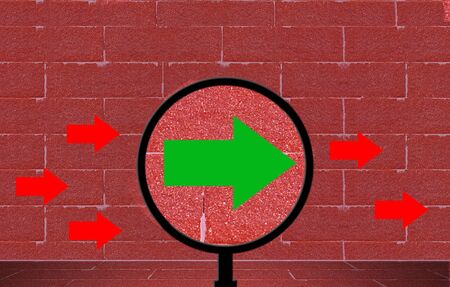 Business vision and success concept, magnifier and arrow on red brick wall, copy spaceの写真素材